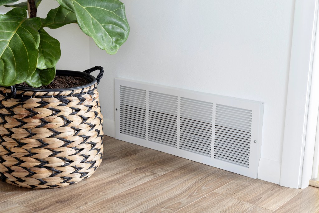 air vent in wall with potted tree