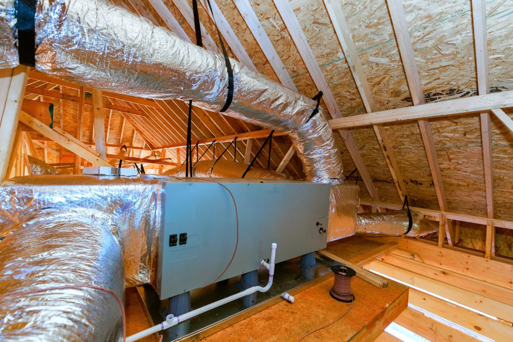 HVAC unit and ductwork in attic of new home build